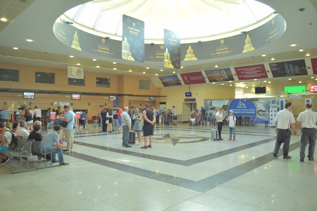 tourists travelling to batumi in batumi airport terminal